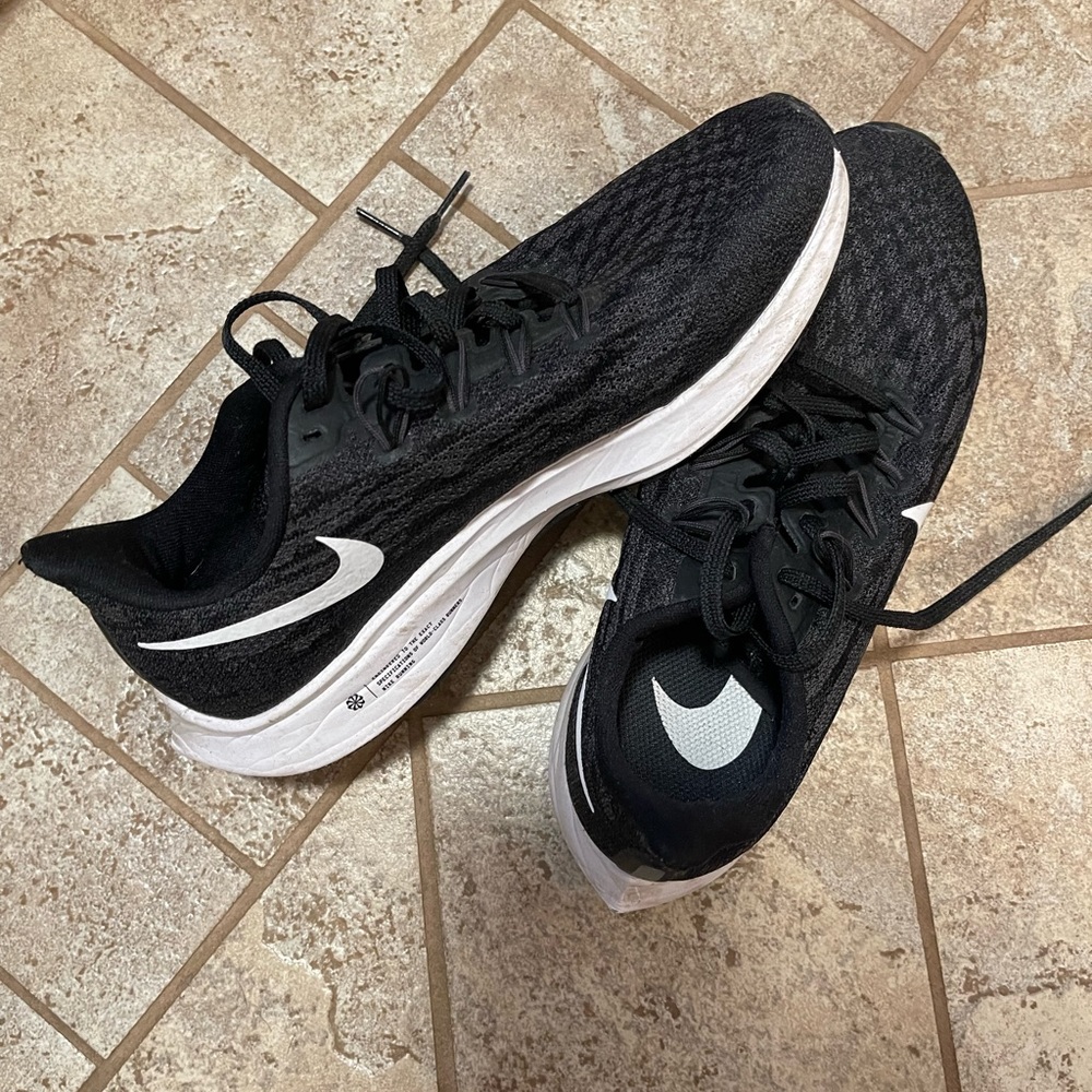 Nike running shoes!! black with white sole!!Like new hardly worn!!